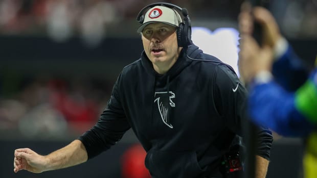 Falcons coach Arthur Smith on the sideline with a headset on